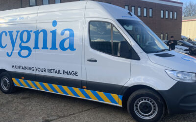 The front-quarter view of a new van with livery for Cygnia Signage Maintenance